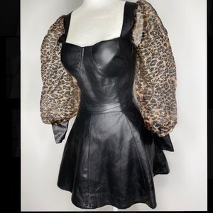 Leather cropped corset with mesh bubble sleeves